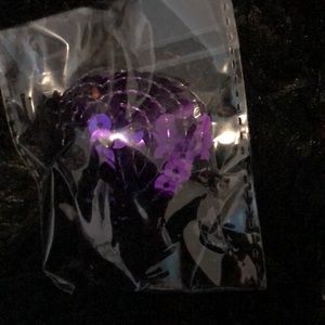 Purple pasties with black tassels